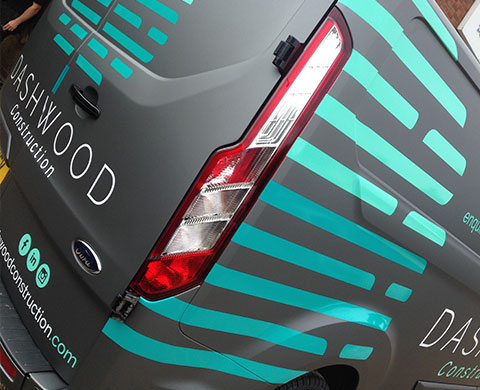 Rear and side view of metallic van wrap