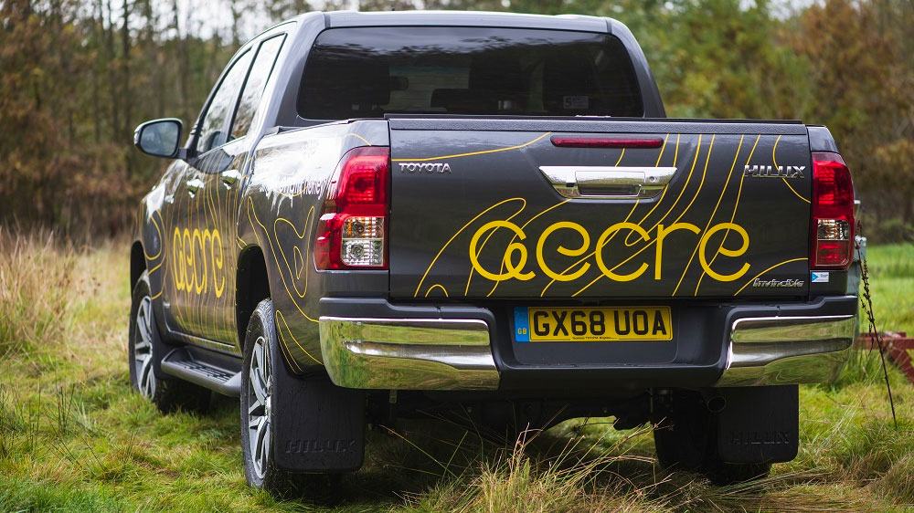 Van wrap for Aecre in black and gold on Toyota Hilux pickup